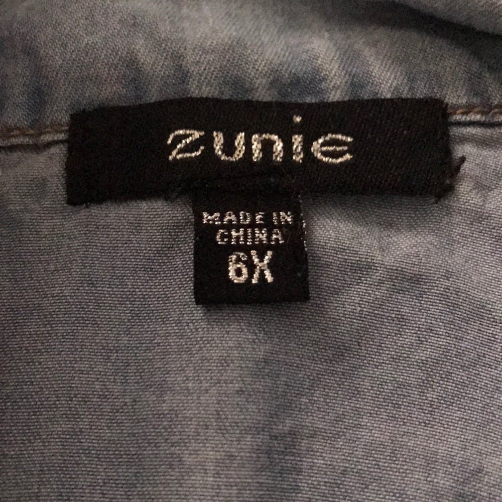 A 6x denim button up dress with pink skirt